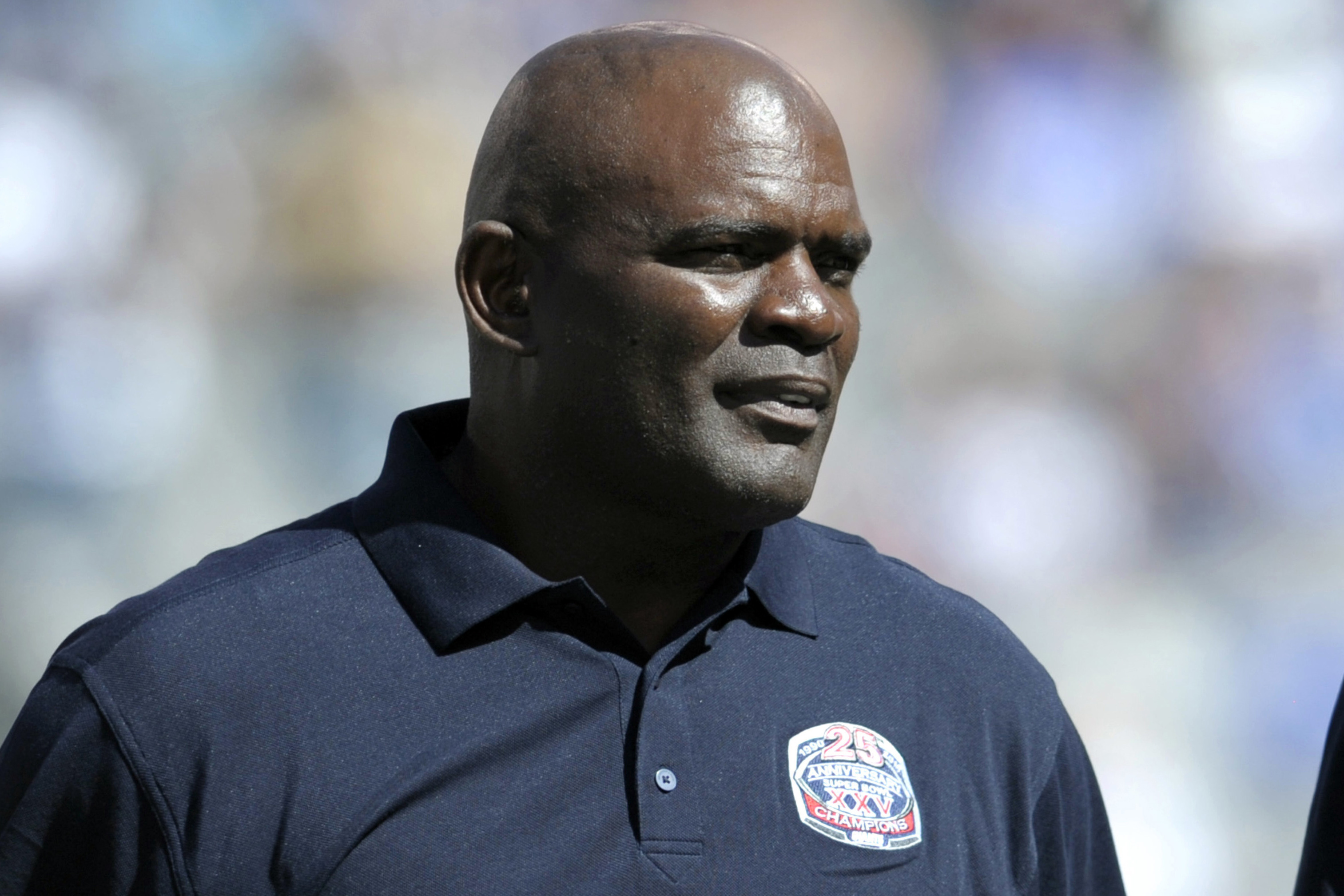 FILE - In this Sept. 20, 2015, photo, former New York Giants' Lawrence Taylor looks on during a 25 year anniversary Super Bowl celebration at halftime of an NFL football game against the Atlanta Falcons in East Rutherford, N.J. Taylor turned himself in at the Broward County Jail in Florida on Wednesday, July 18, 2024 and was released on bail. The reason was his failure to report a residence change as a registered sex offender, the Pembroke Pines Police Department said. (AP Photo/Bill Kostroun, File)