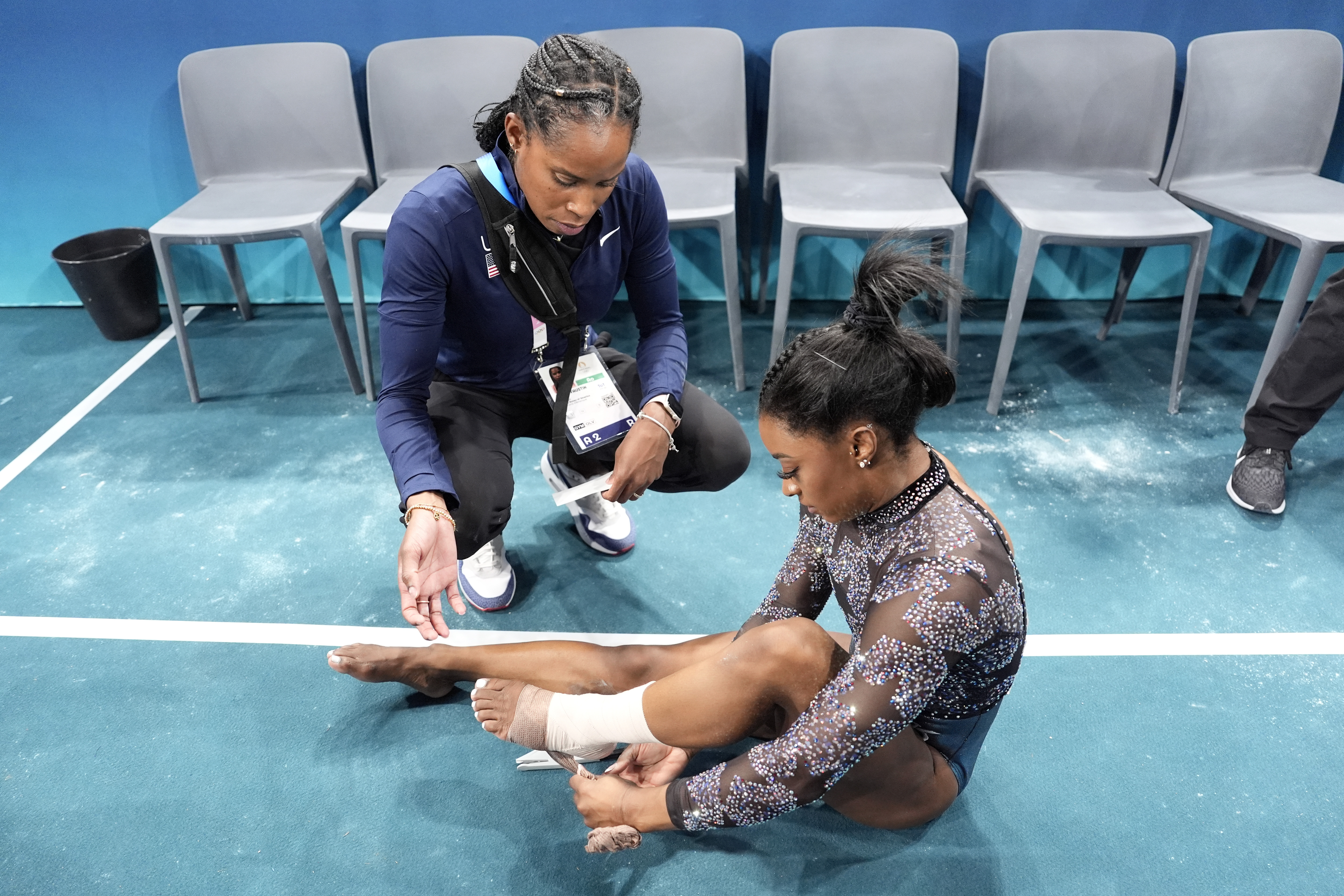 Simone Biles overcomes injury to lead Olympics gymnastics all-around