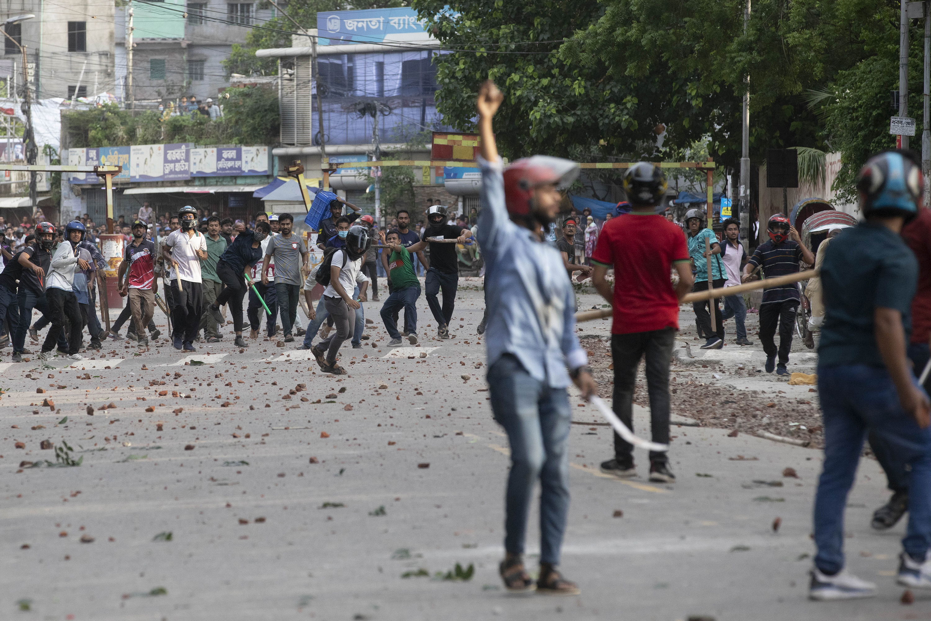 Bangladesh: 5 killed, dozens injured in clashes over government jobs quota | AP News