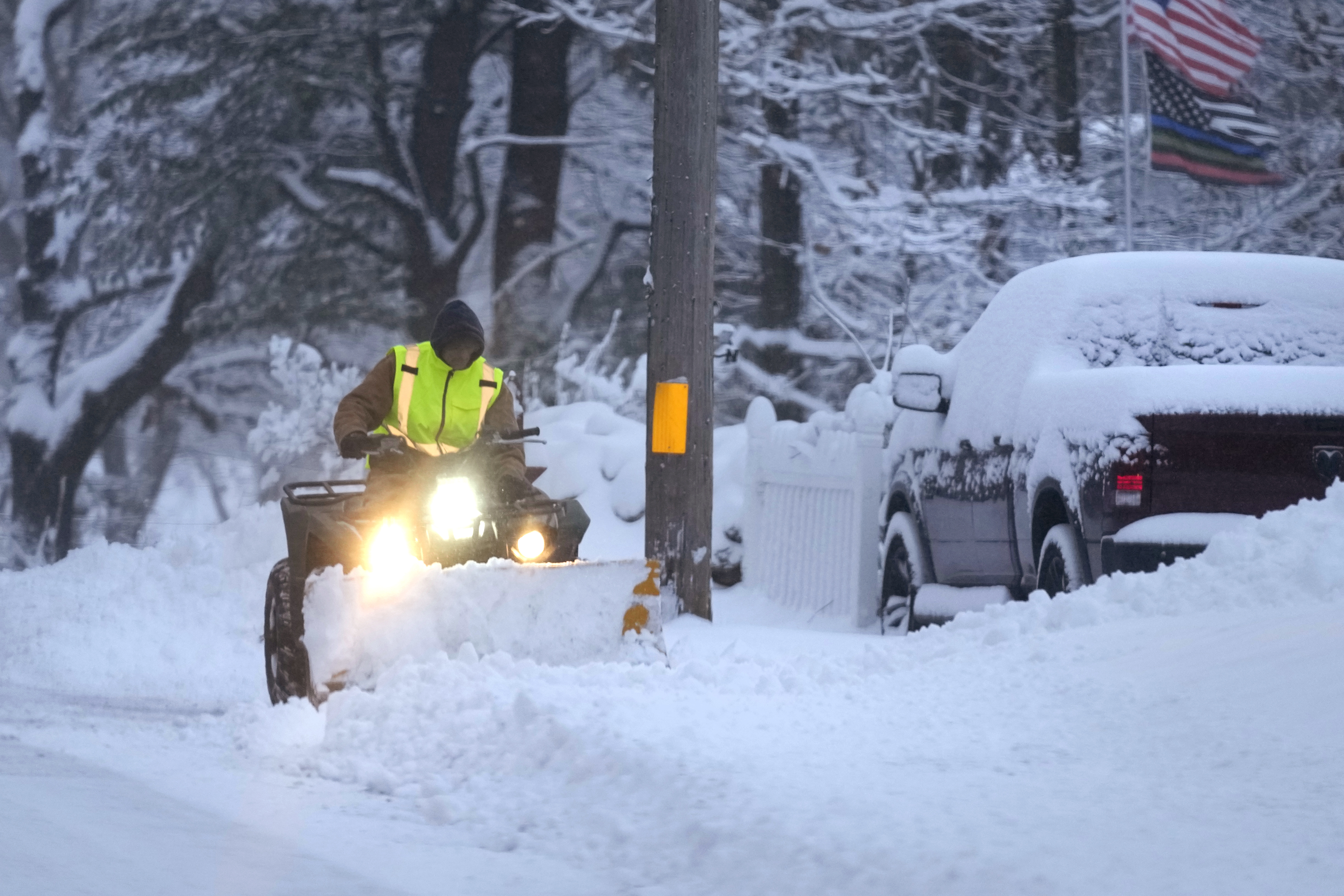 Major winter storms bring snow, ice and travel hazards to both US coasts