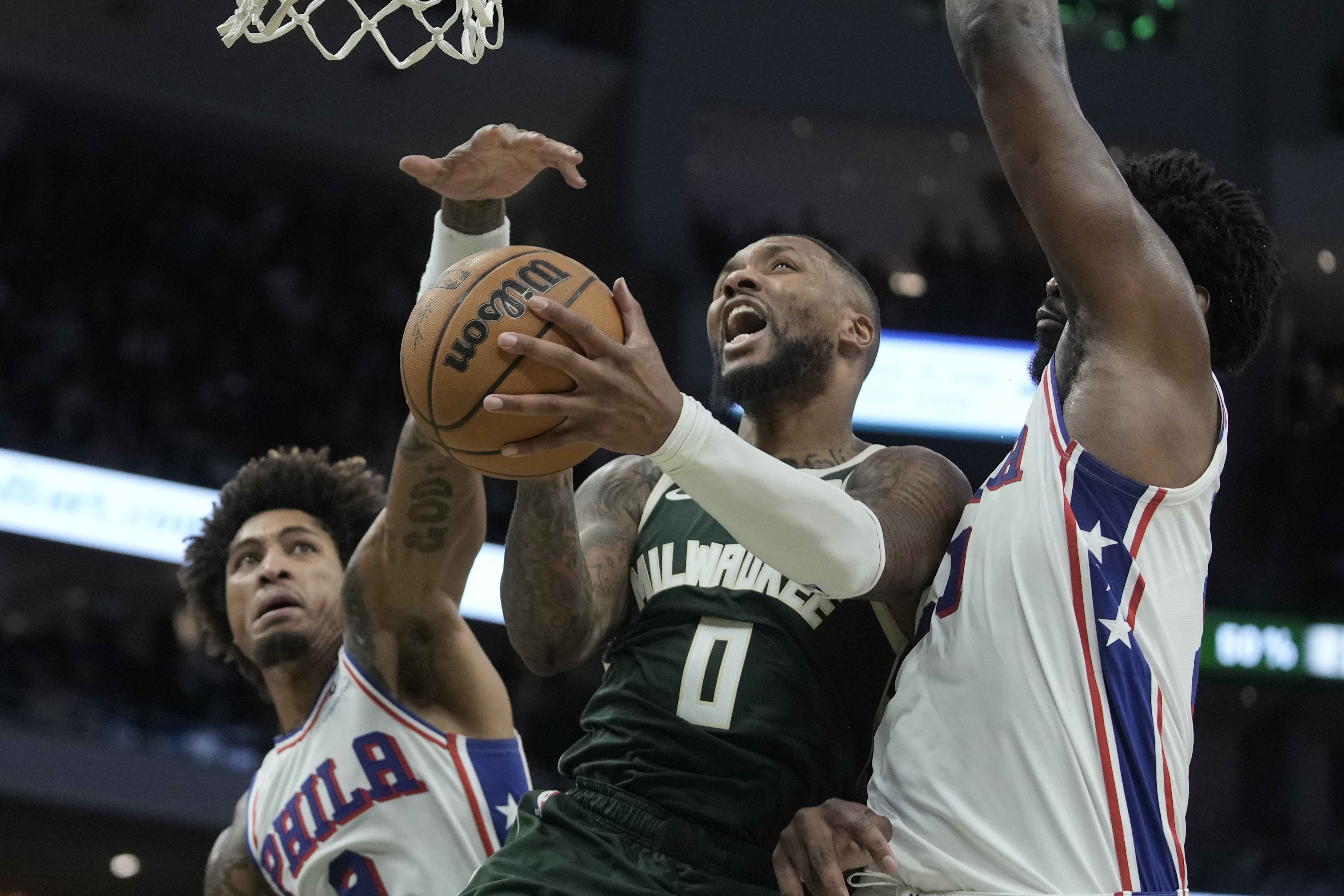 Giannis and Lillard combine for 78; Rivers wins first game with Bucks