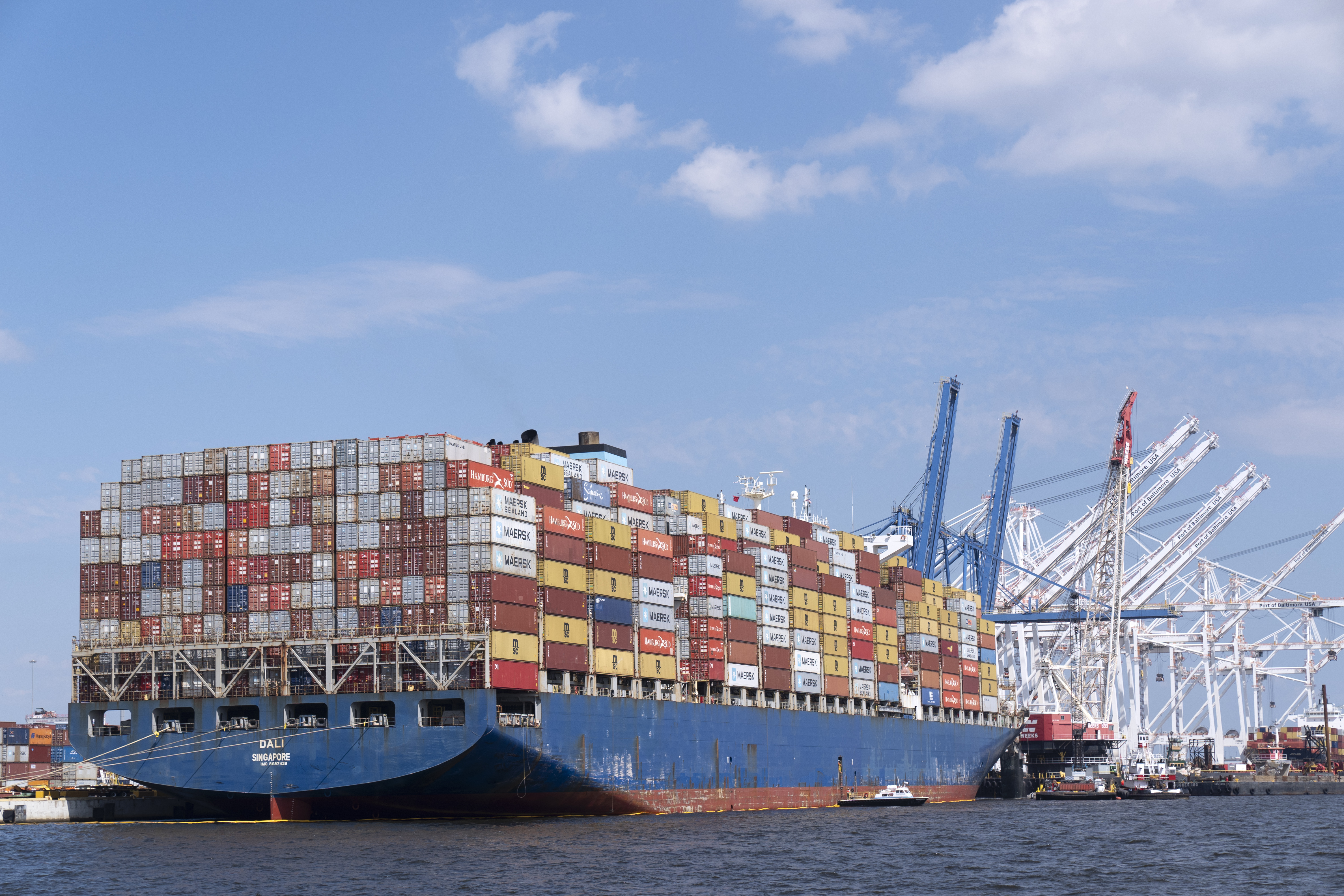 Cargo ship that caused Baltimore bridge collapse escorted to port | AP News