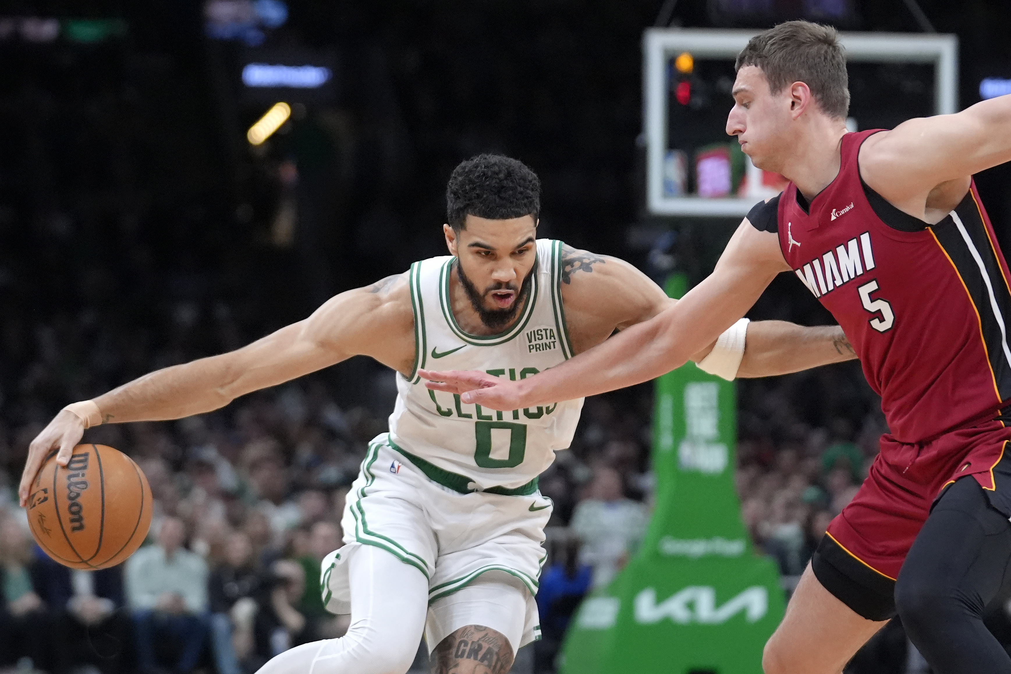 Jayson Tatum triple-double, 3s lead Celtics past Butler-less Heat 114-94 in  playoff opener | AP News