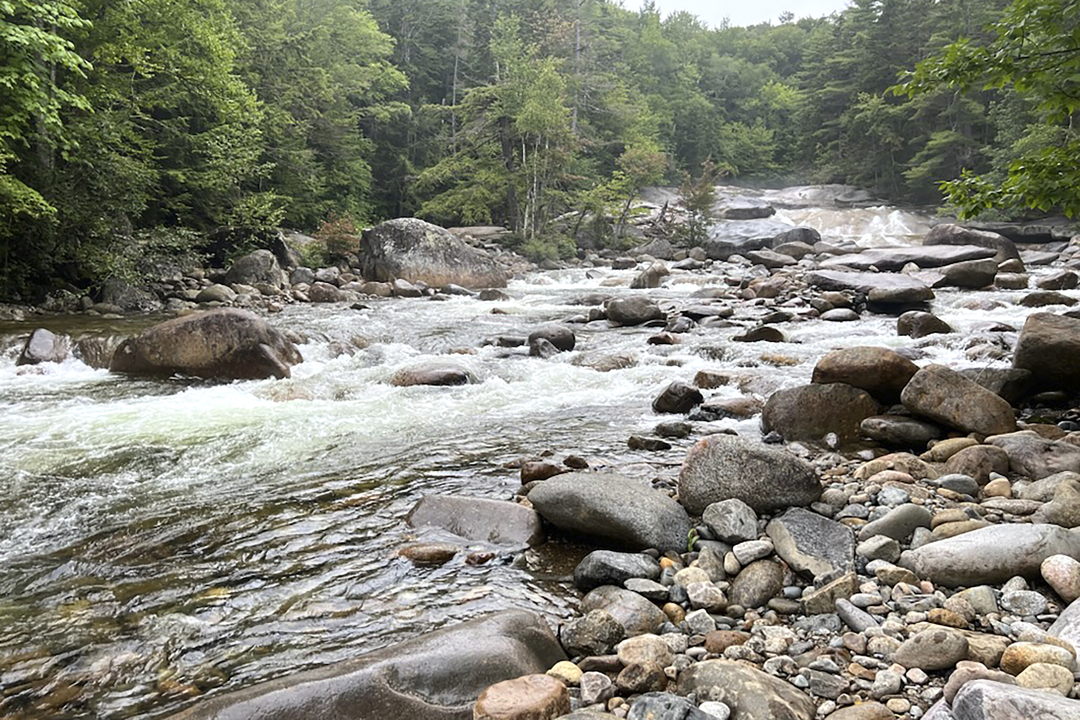 A family outing at a popular waterfall turns grim as mother drowns