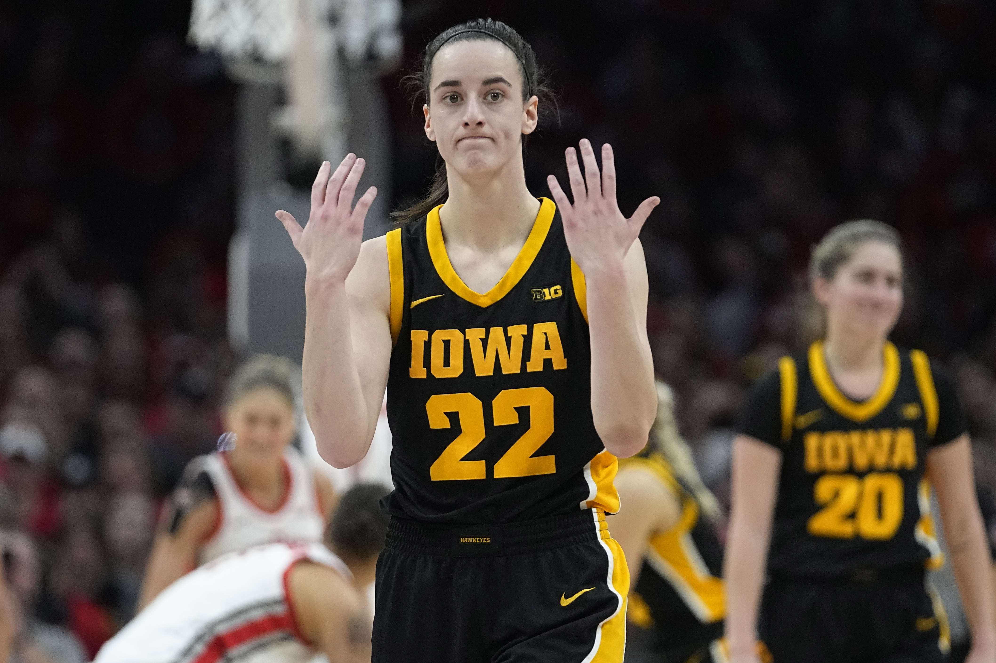 Iowa's Caitlin Clark knocked down by Ohio State fan running on court | AP  News