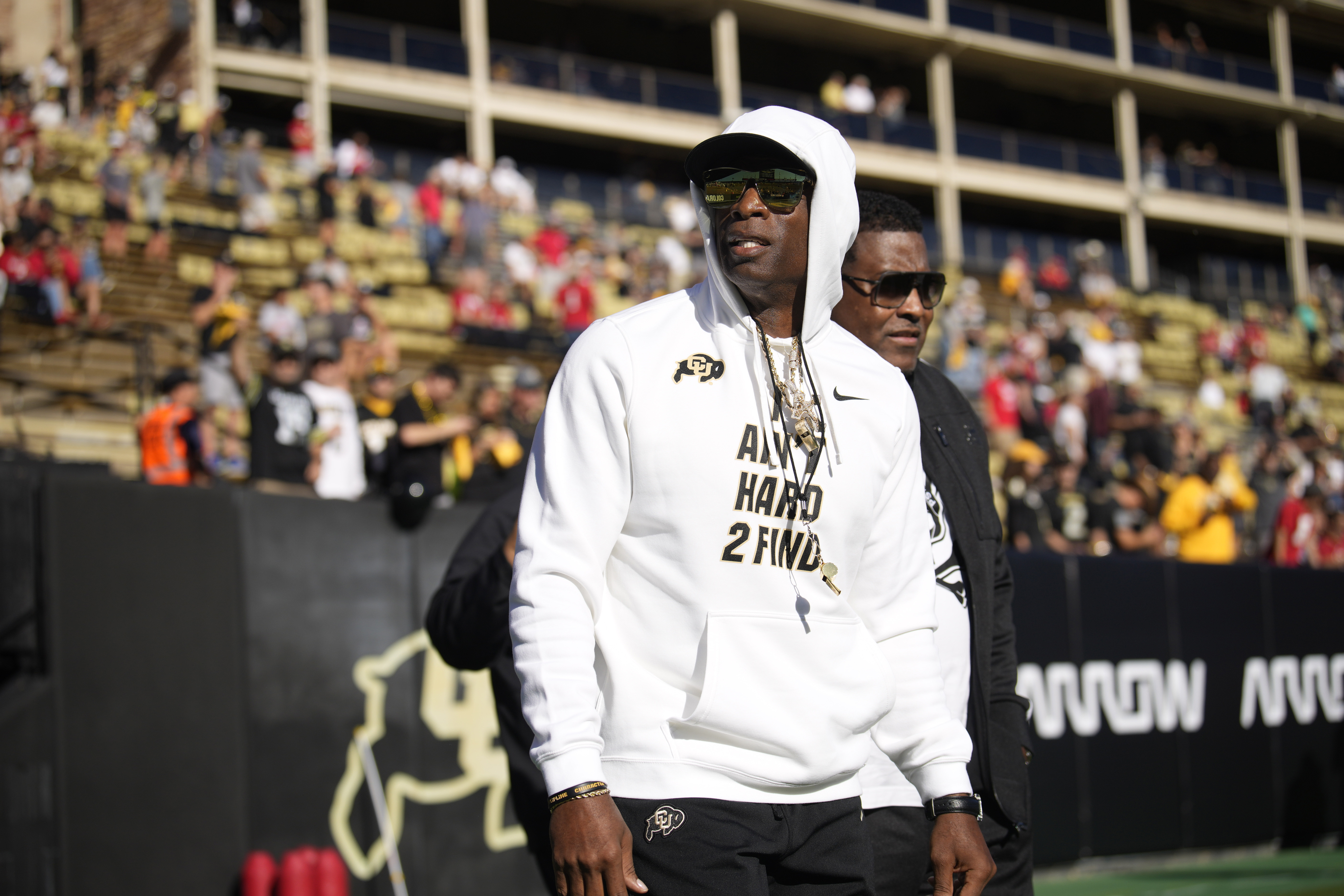 Deion Sanders hands out sunglasses after Jay Norvell's criticism