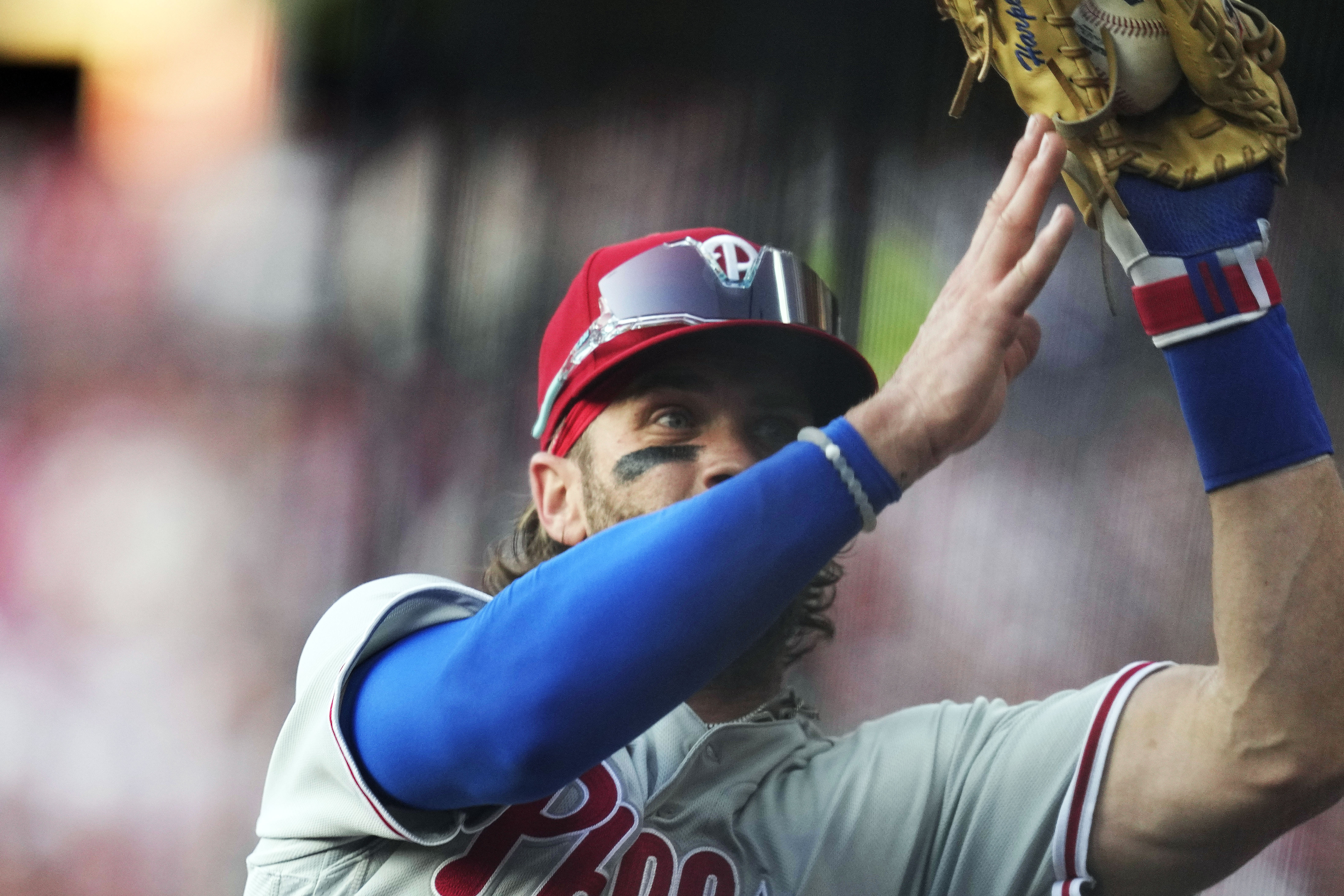 Phillies star Bryce Harper makes catch tumbling into photo pit in