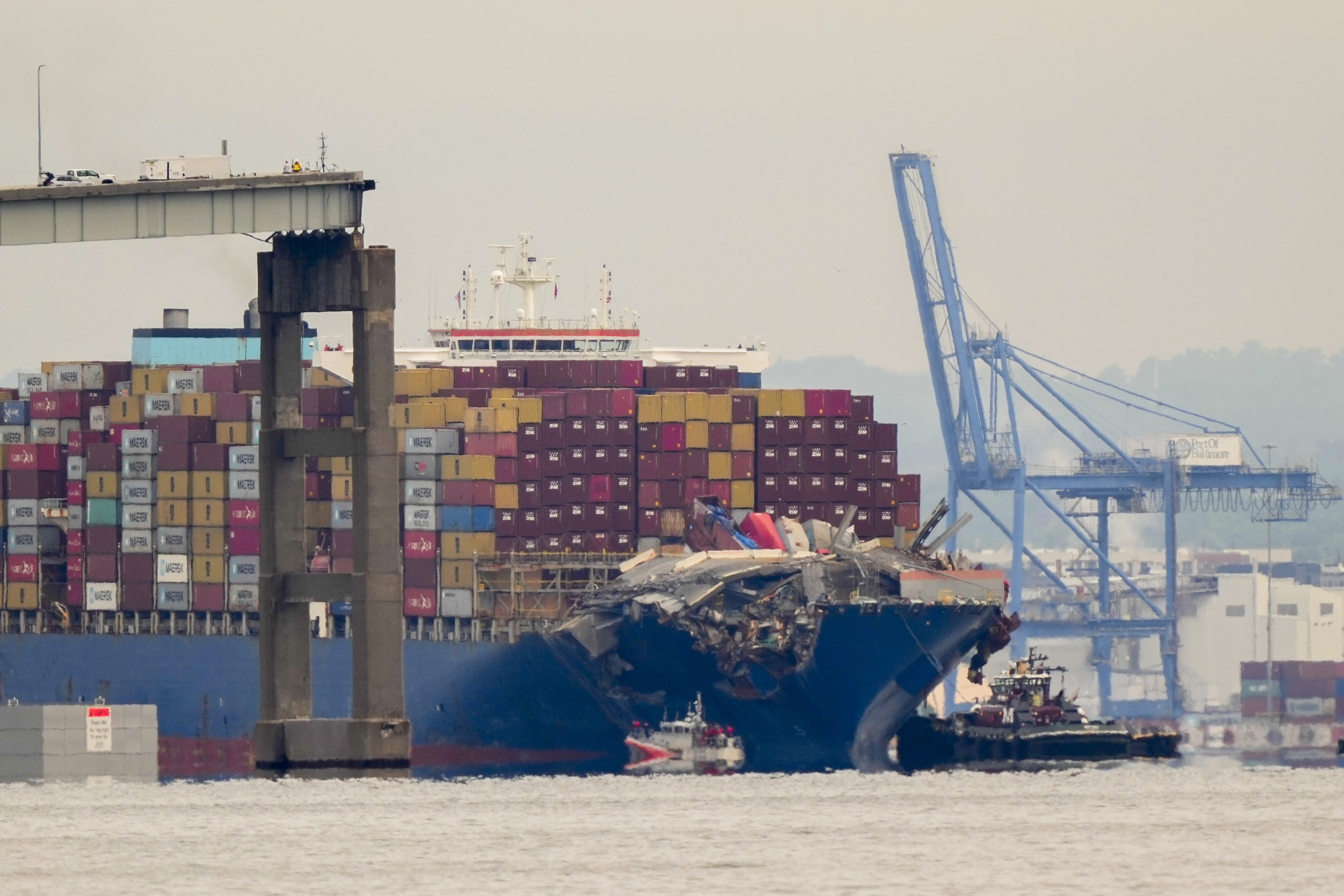 Cargo ship that caused Baltimore bridge collapse escorted to port | AP News