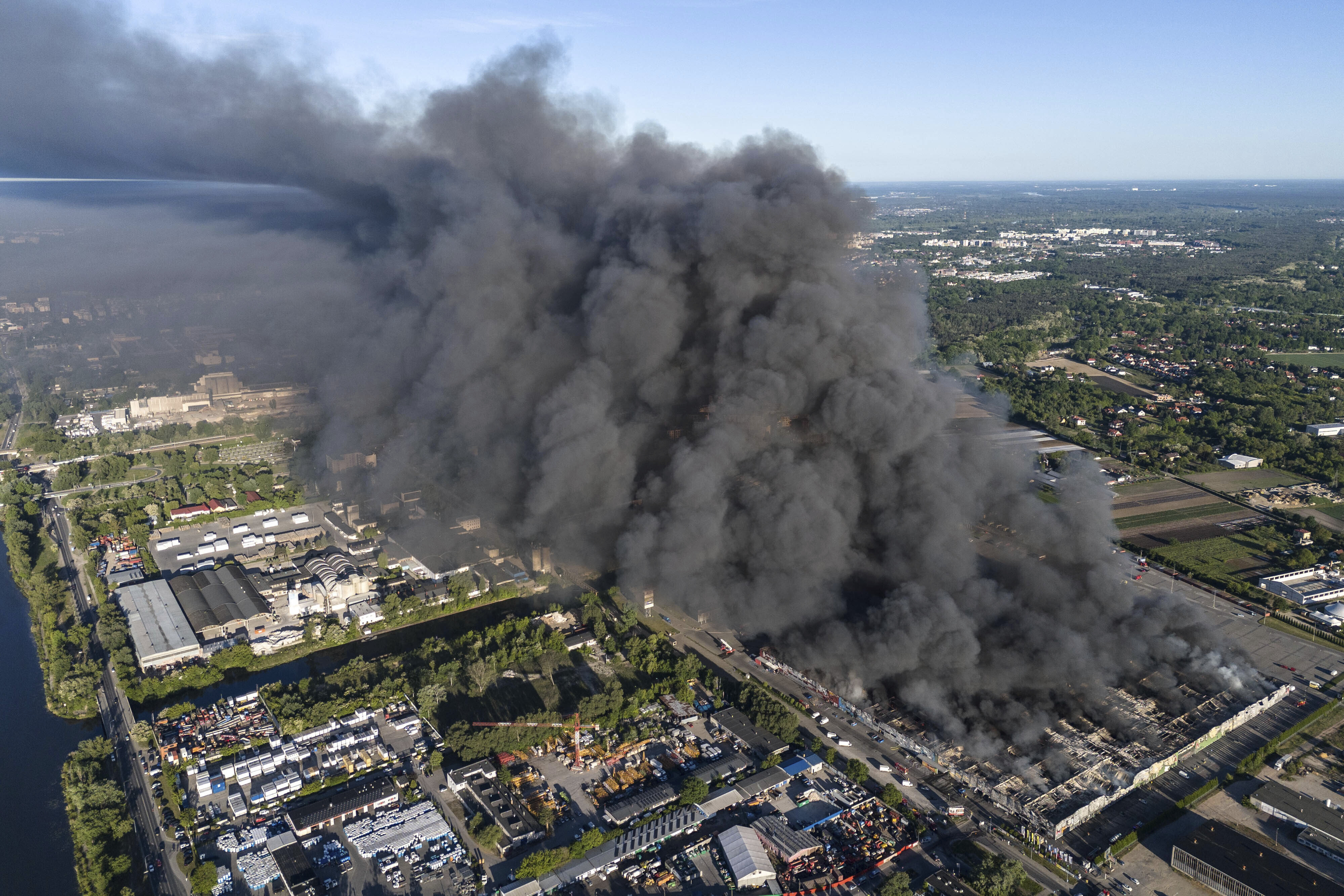 Fire burns down shopping center housing 1