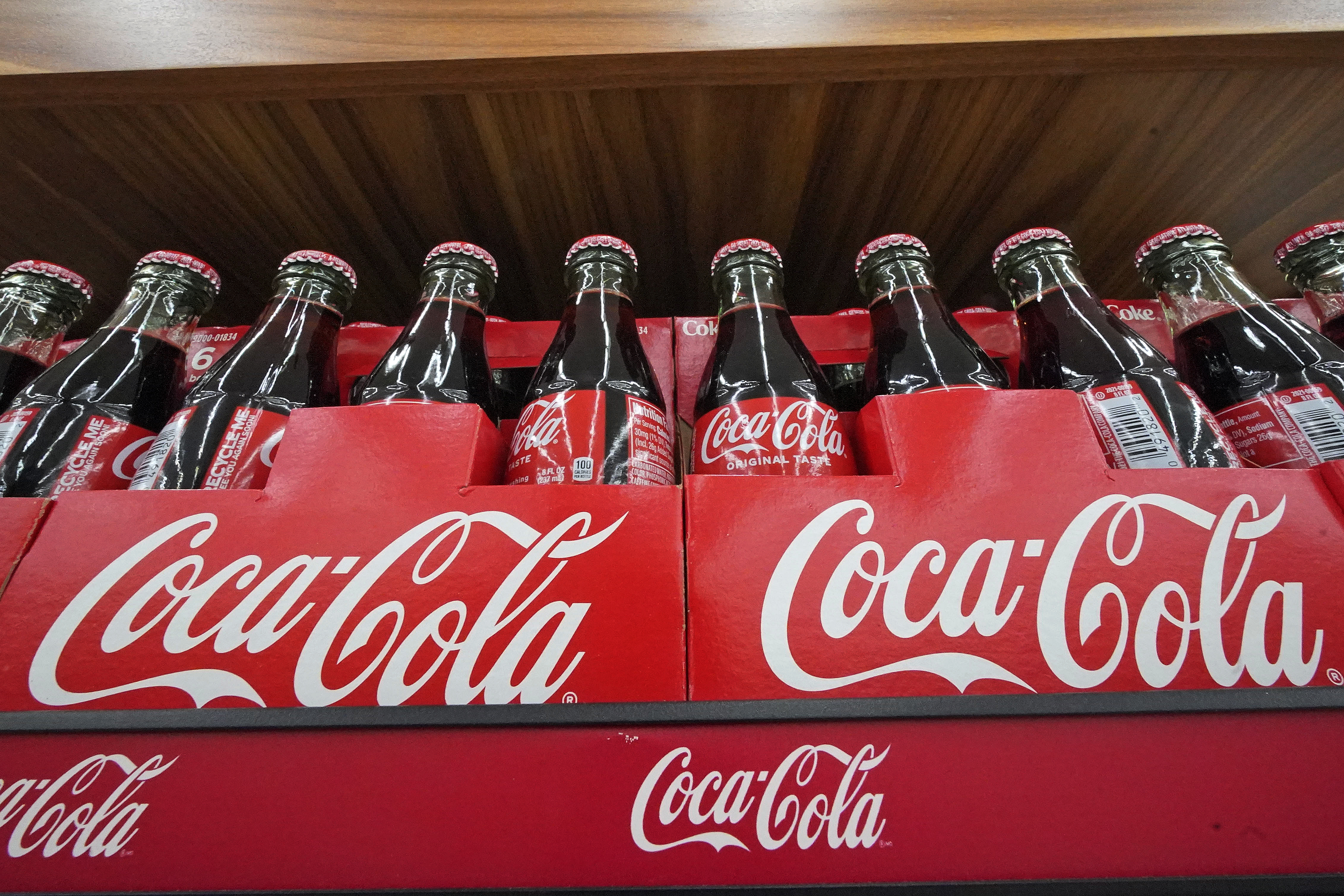 Coca-Cola lifts forecasts as earnings sparkle on higher prices, steady  demand