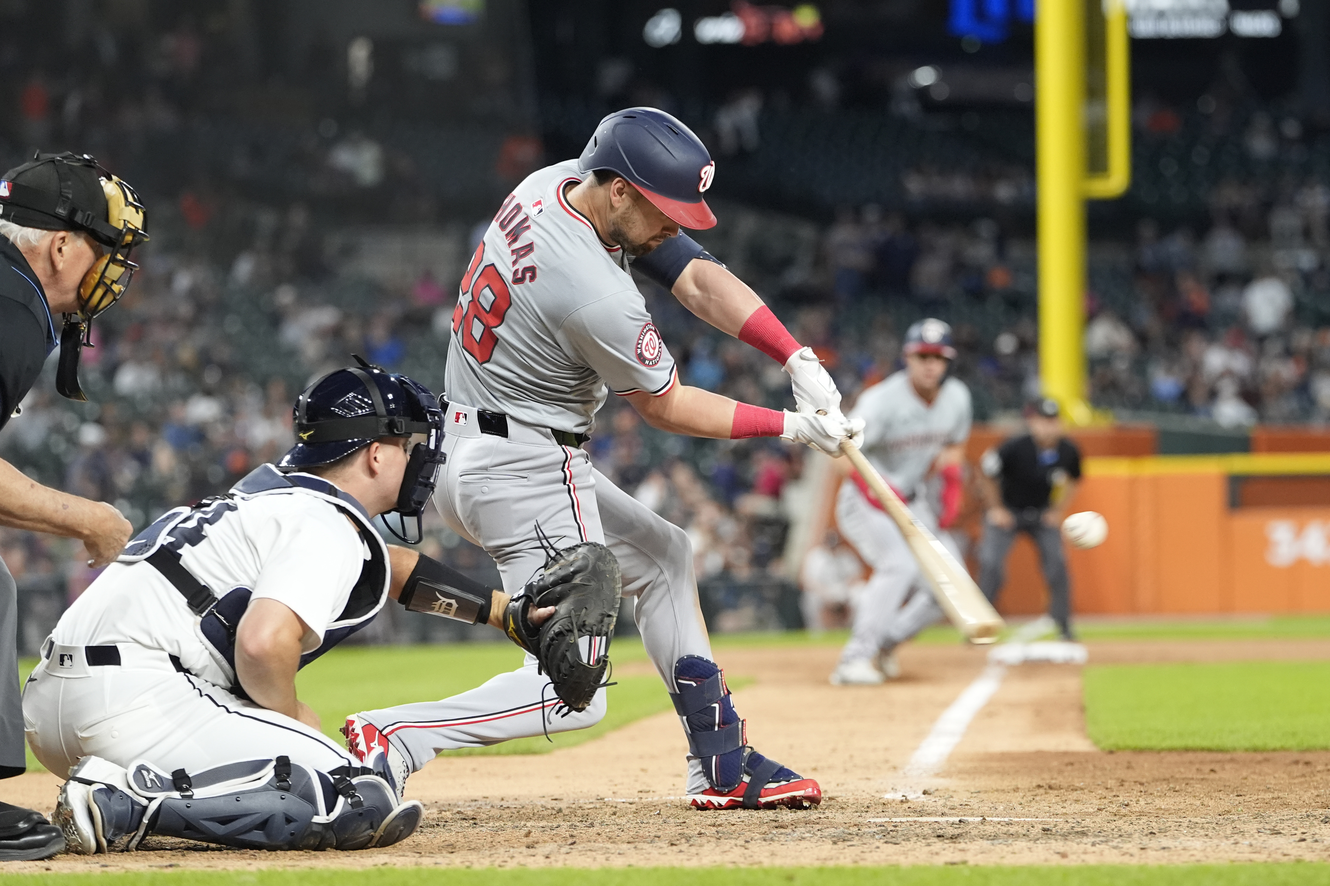 Lane Thomas' 10th-inning sacrifice fly lifts the Nationals over the Tigers 5-4