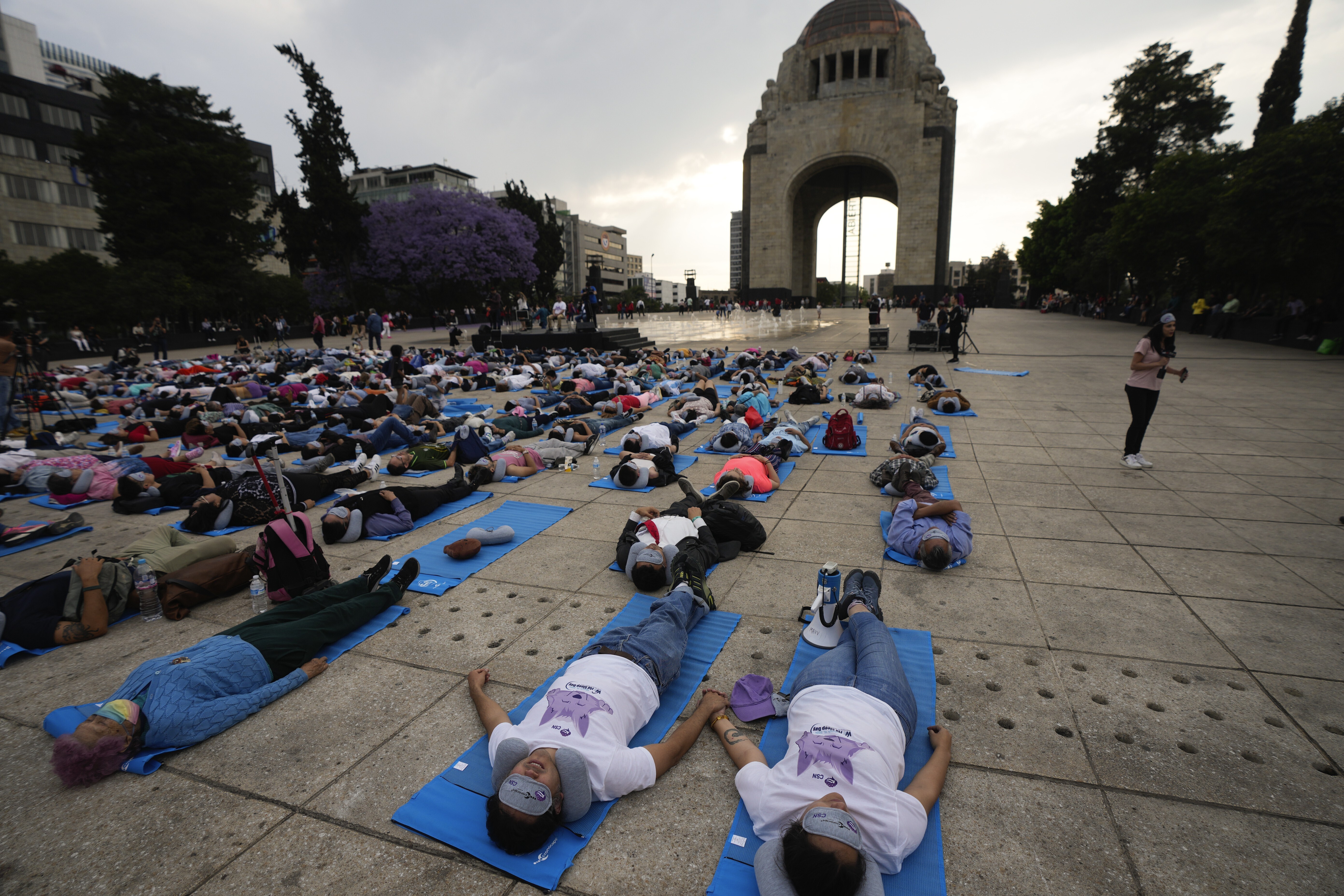 World Sleep Day: Hundreds of people in Mexico City stretch out for a 'mass  nap