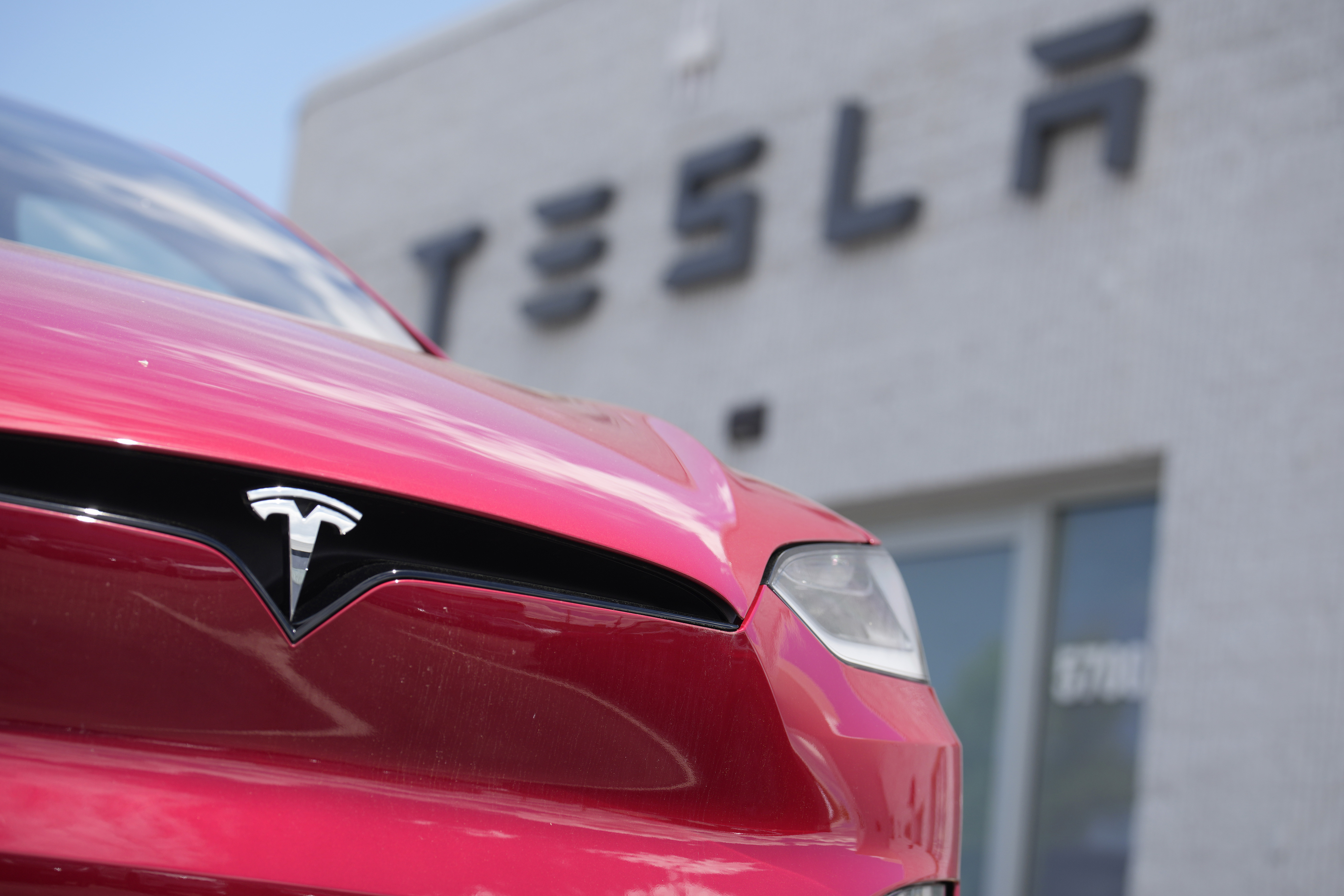Tesla income jumps 20%, but shares fall after hours amid profit